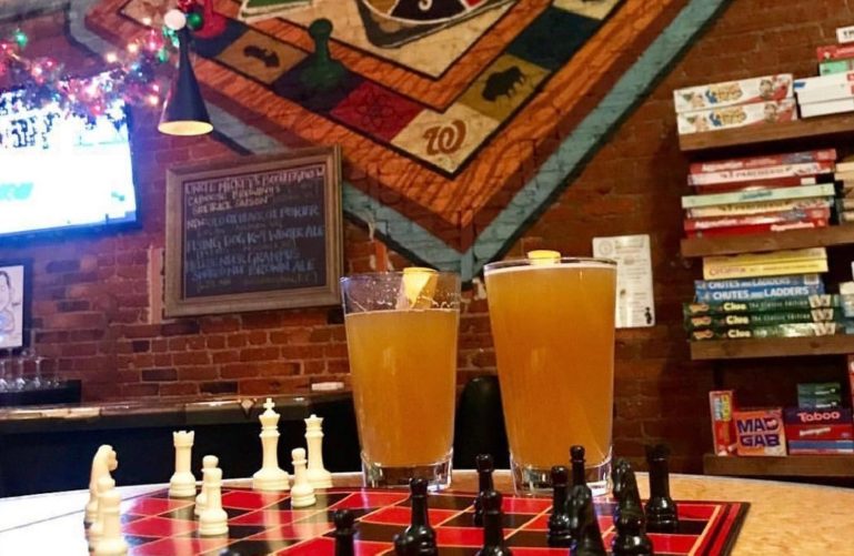 Two glasses of beer and a chess board at the Board Room DC