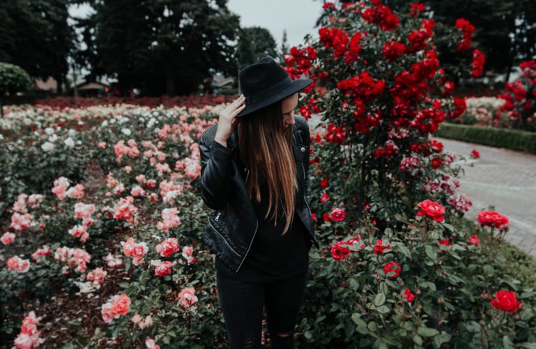 a girl in a rose garden