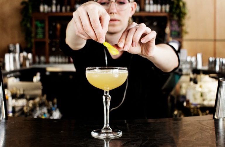 Bartender makes a cocktail, Tattersall Distilling, Minneapolis